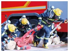 Firefighters deploying hose lines during an incident