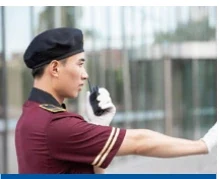 Uniformed property officer speaking into a two-way radio